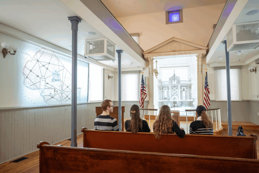 Visitors watching the immersive film in the historic Sanctuary, Fall 2023. Chris Ferenzi Photography
