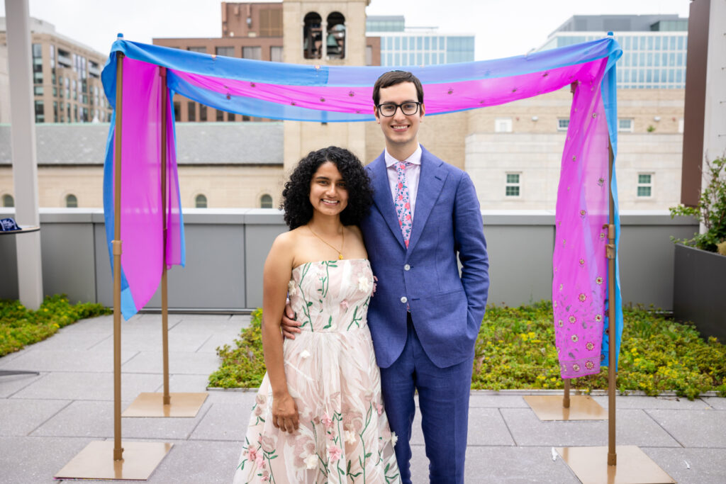Bride and Groom pose for photos in front of their chuppah on the Museum's rooftop terrace, Spring 2025. Photo: Nichole Terry